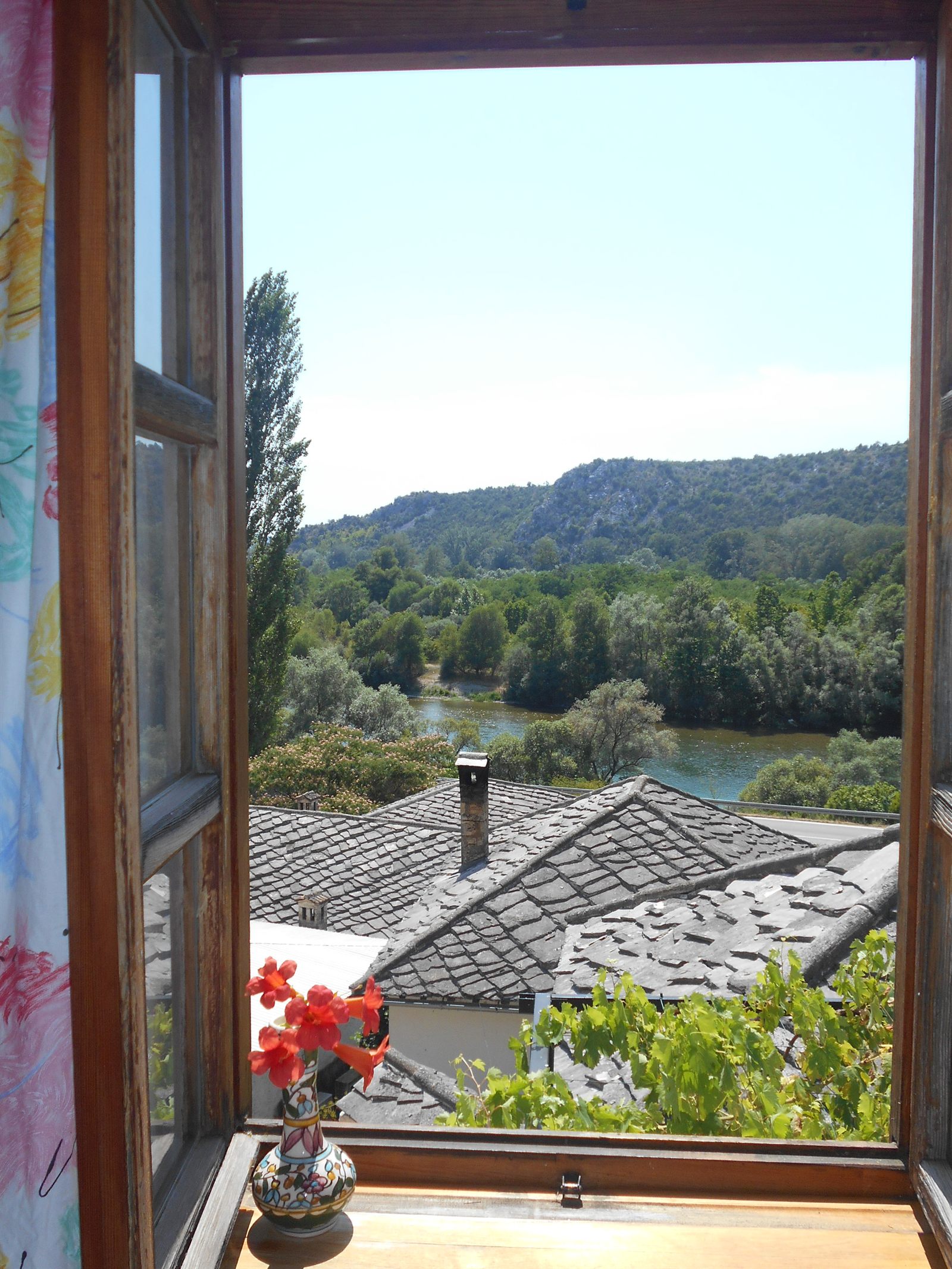 View of the Neretva valley through an open window at Hostel Raza
